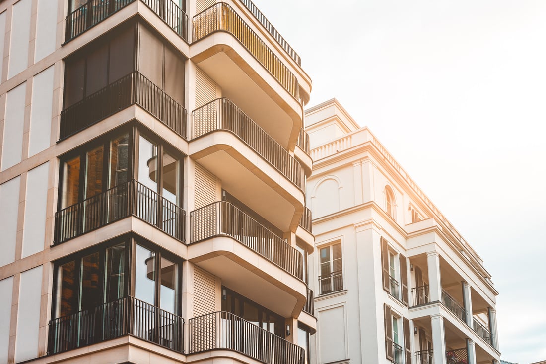 beautiful new apartment buildings with modern facade and warm sunlight for real estate themes